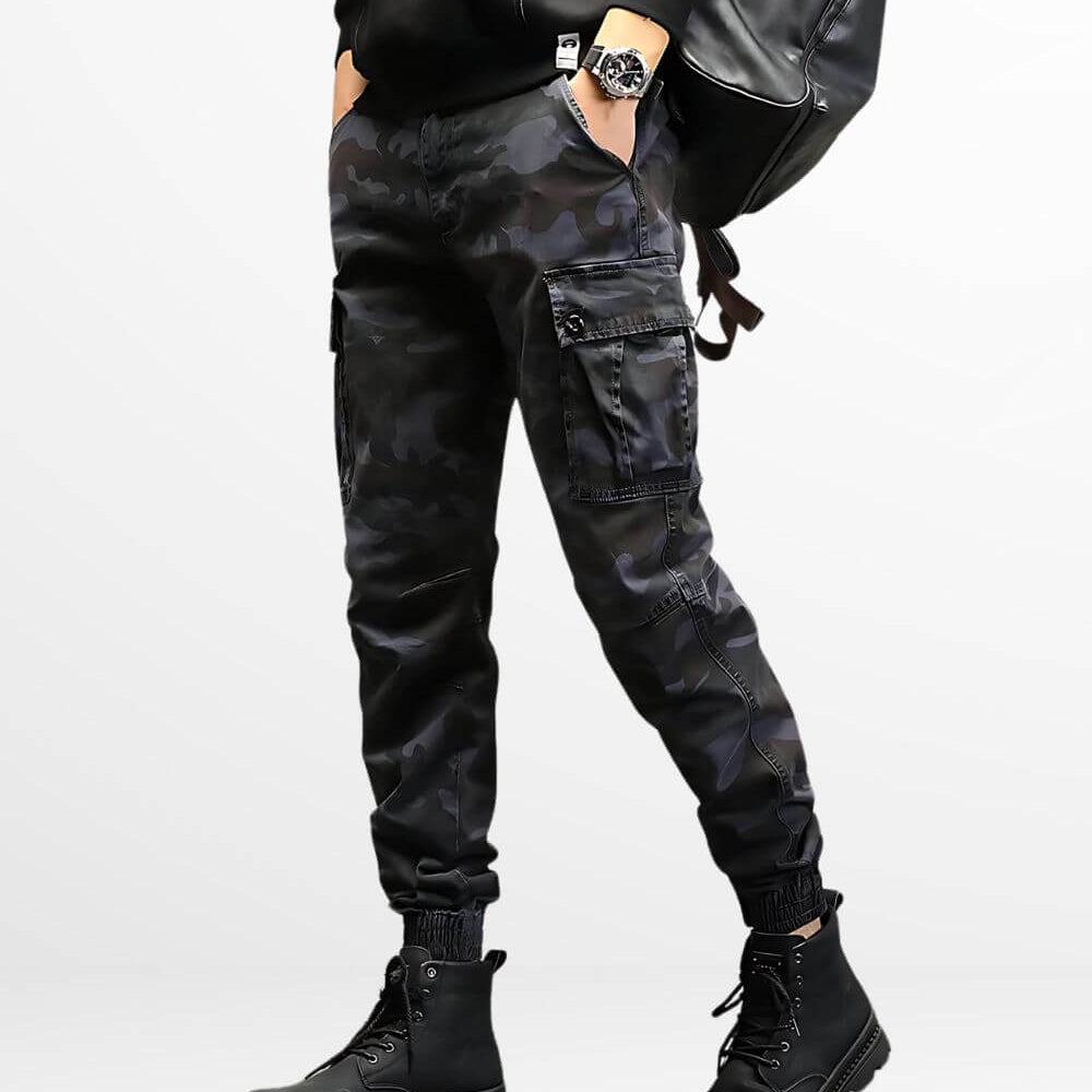 Man sporting slim-fit camo cargo pants paired with black combat boots, highlighting a contemporary and sleek style with practical design features.