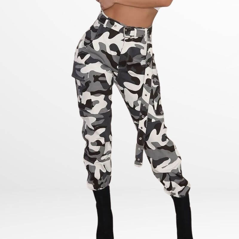 Model wears Camo Cargo Pants High-Waisted with a black and white camouflage pattern, highlighting the trendy high waist and pocket details, paired with black heels.