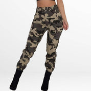 Rear view of Camo Cargo Pants High-Waisted in green camo, focusing on the back fit and pocket design, coordinated with a sleek black top and ankle boots.