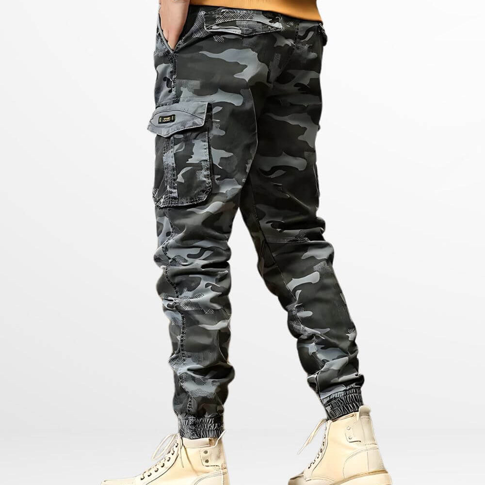 Side view of men's grey camo cargo pants showing the pocket design and casual fit.
