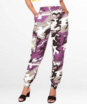 Woman wearing fitted purple camo cargo pants with multiple utility pockets.