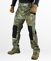 Full body view of a stylish streetwear outfit featuring women's cargo camo pants in grey camouflage, accessorized with a belt and worn with black ankle boots.