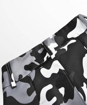 Close-up of the waistband detail on women's black and white camo cargo pants.