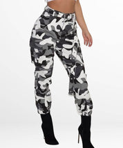 Side view of women's black and white camo cargo pants, showcasing the fit and side pockets.