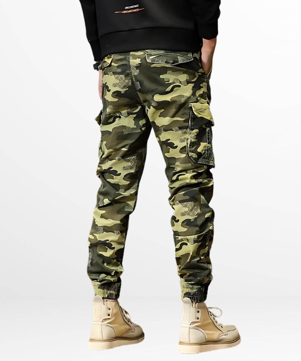 Casual style with green camo cargo jogger pants complemented by cream-colored high-top boots, featuring a side pocket detail for a functional look.