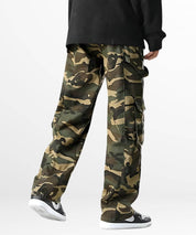 Back view of a man wearing men's baggy camo cargo pants, showcasing the loose fit and pocket details that complement the streetwear aesthetic.
