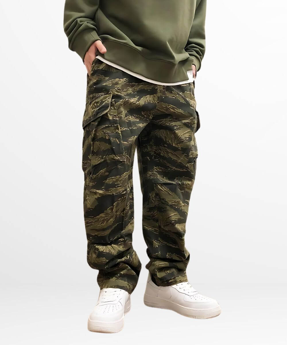 Close-up of baggy camo cargo pants complemented by crisp white sneakers for a streetwear vibe.