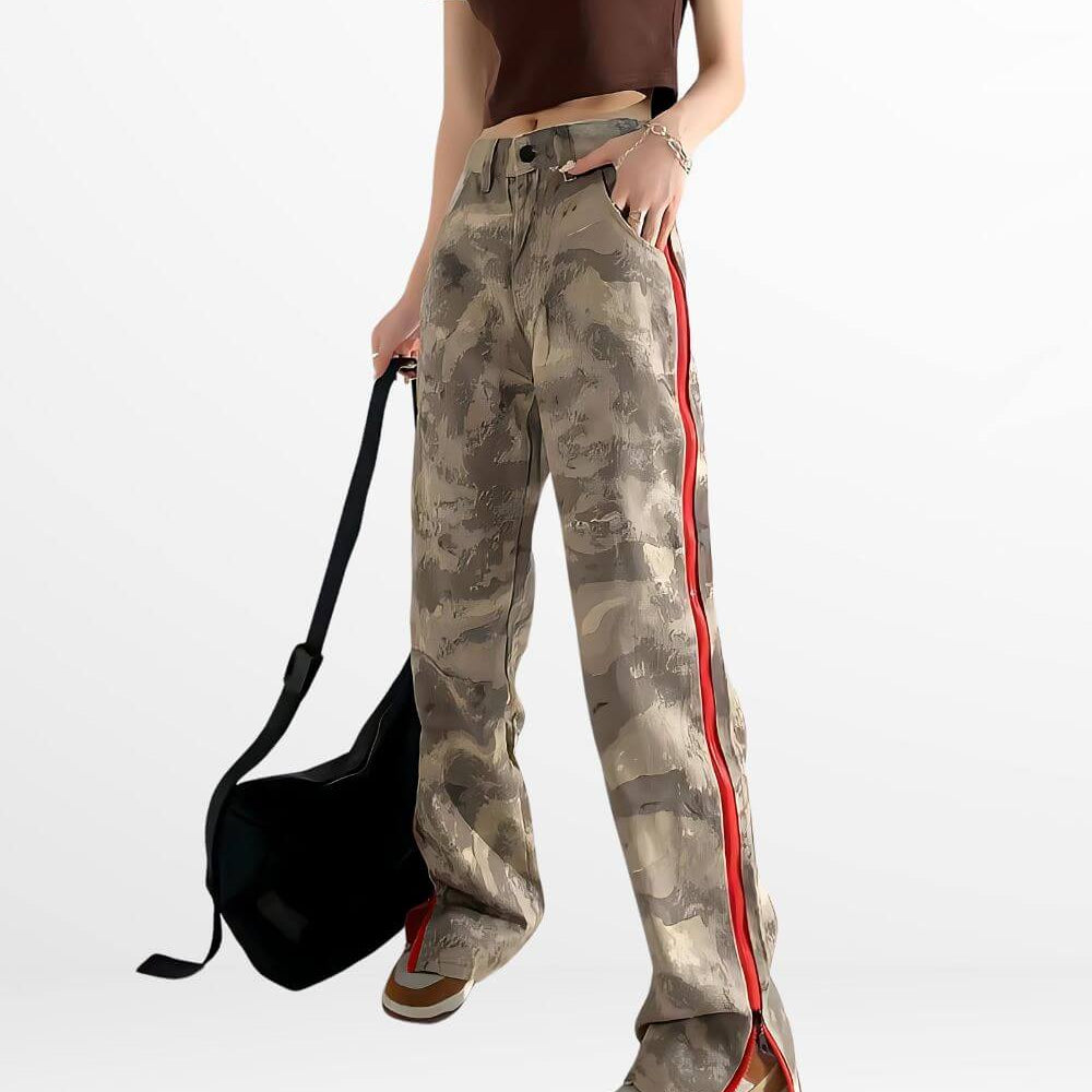 Casual look featuring baggy camo cargo pants for women with a red side stripe, complete with a black shoulder bag and casual footwear.