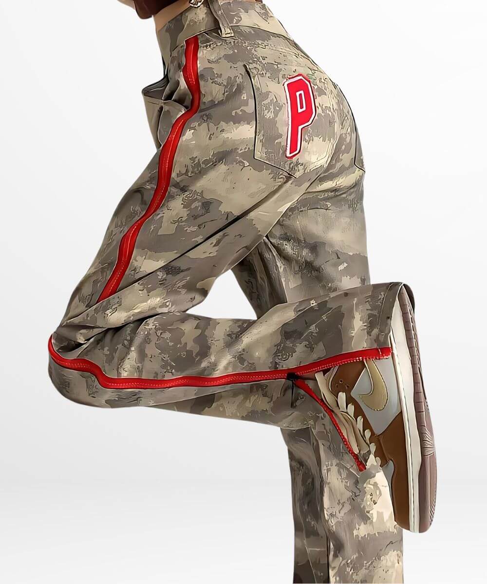 Dynamic pose showing off baggy camo cargo pants for women with red detailing, demonstrating the pants' comfort and versatility.