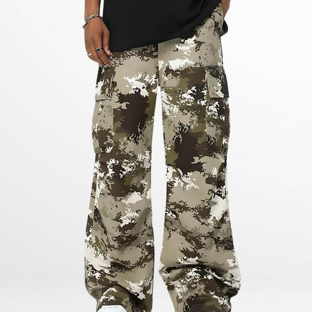 front view of baggy camouflage pants with detailed side pockets and white sneakers.