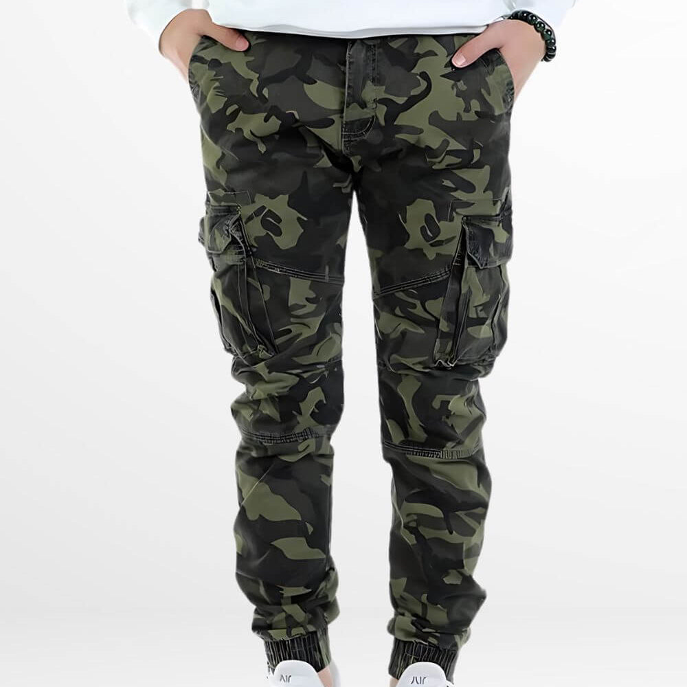 Front view of Black and Green Camo Pants with a modern fit, styled with white sneakers.