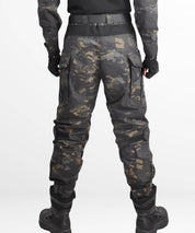 Back view of black camouflage hunting pants with knee pads and secure waistband.