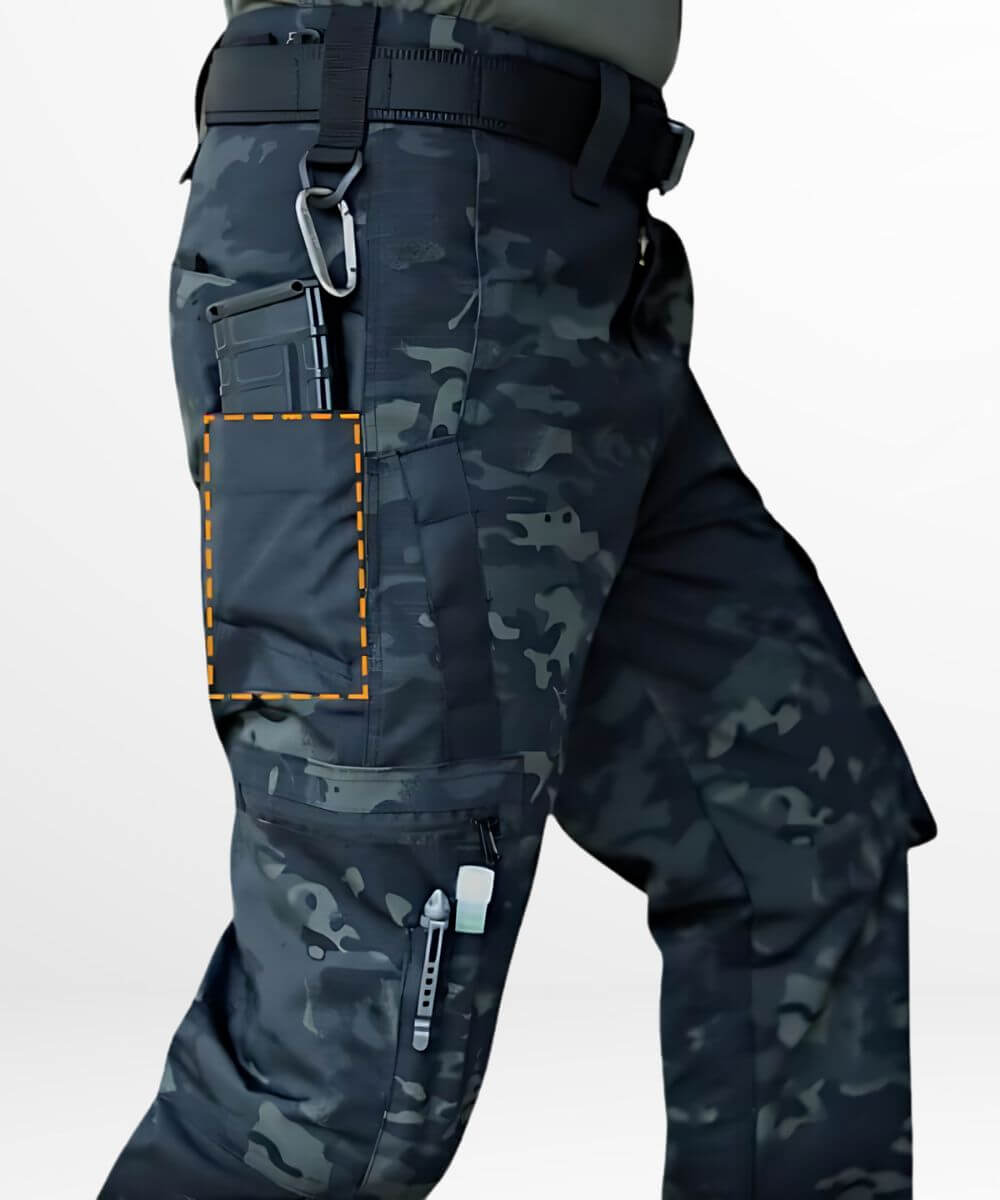 Close-up of the side pocket on black camo military pants, showcasing the secure stitching and camouflage pattern.