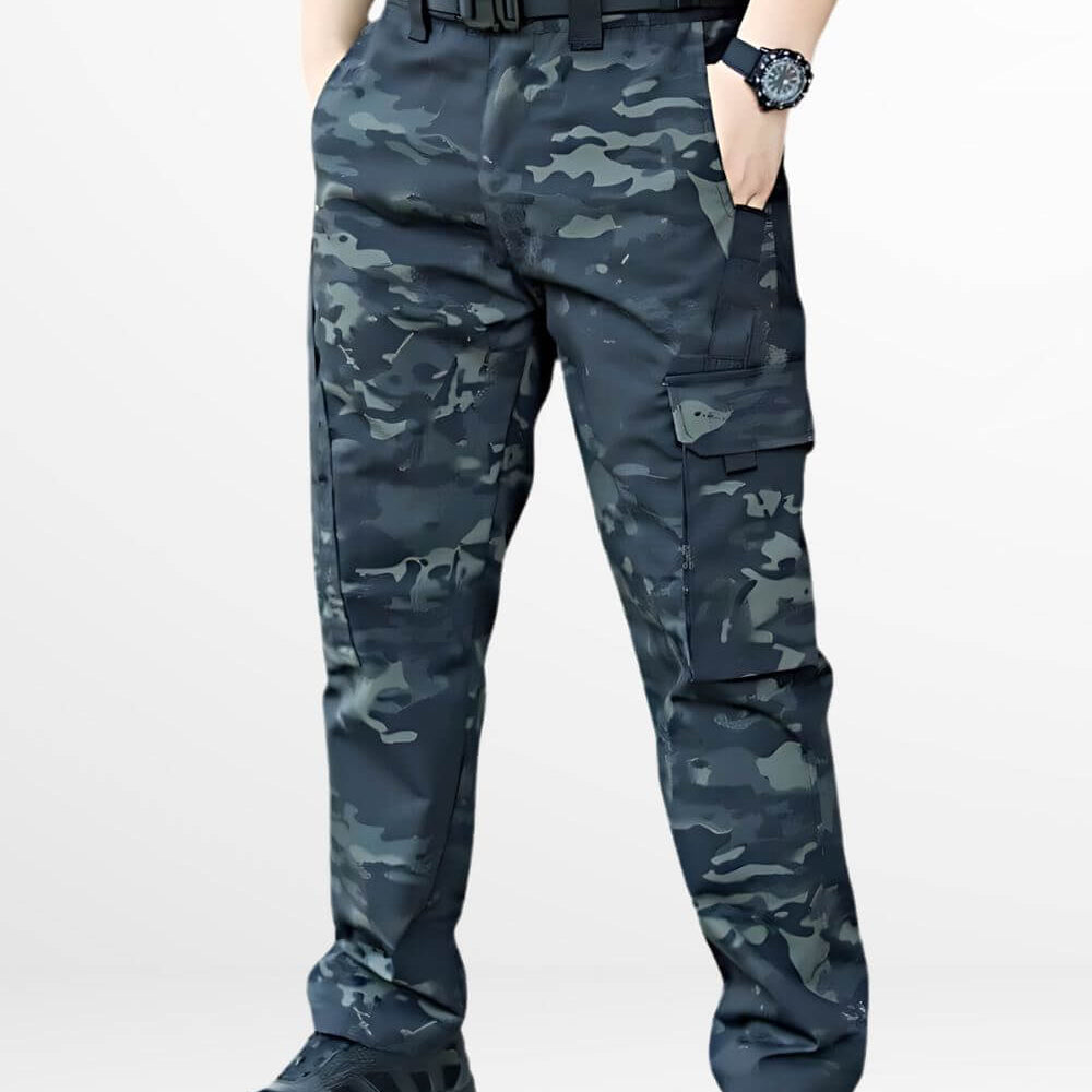 Front view of black camo military pants with tactical pockets and a robust belt, paired with athletic shoes.