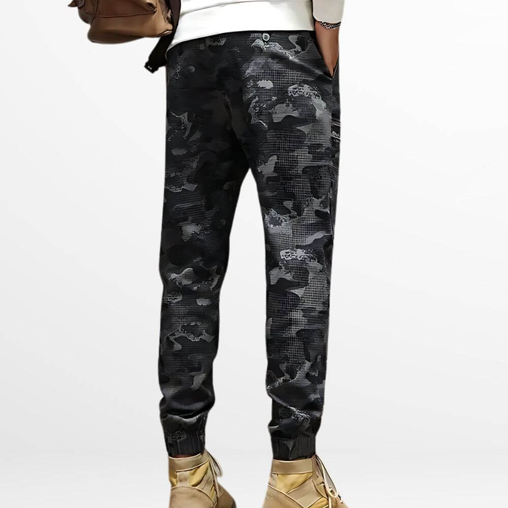 Back view of black and grey camo cargo pants with stylish tan boots, highlighting the casual streetwear vibe.