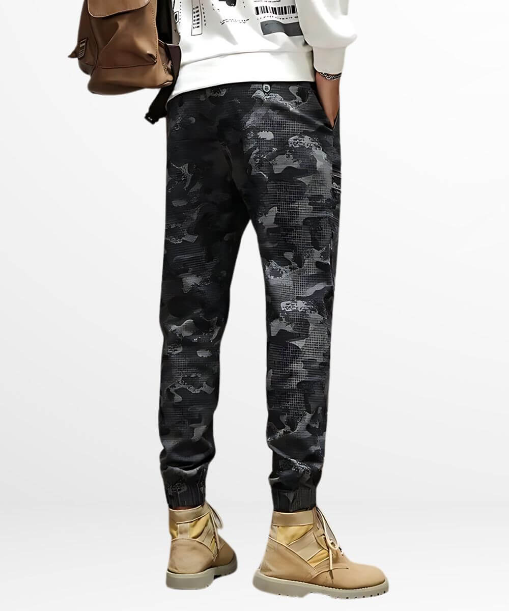 Back view of black and grey camo cargo pants with stylish tan boots, highlighting the casual streetwear vibe.