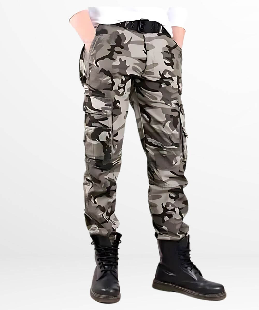 Casual style of black, grey, and white camo cargo pants paired with black boots and a fitted black shirt.