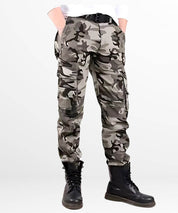 Casual style of black, grey, and white camo cargo pants paired with black boots and a fitted black shirt.