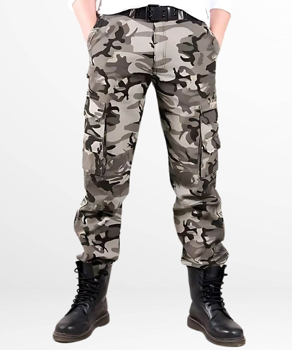 Front view of black, grey, and white camo cargo pants with a black belt and boots, against a white background.