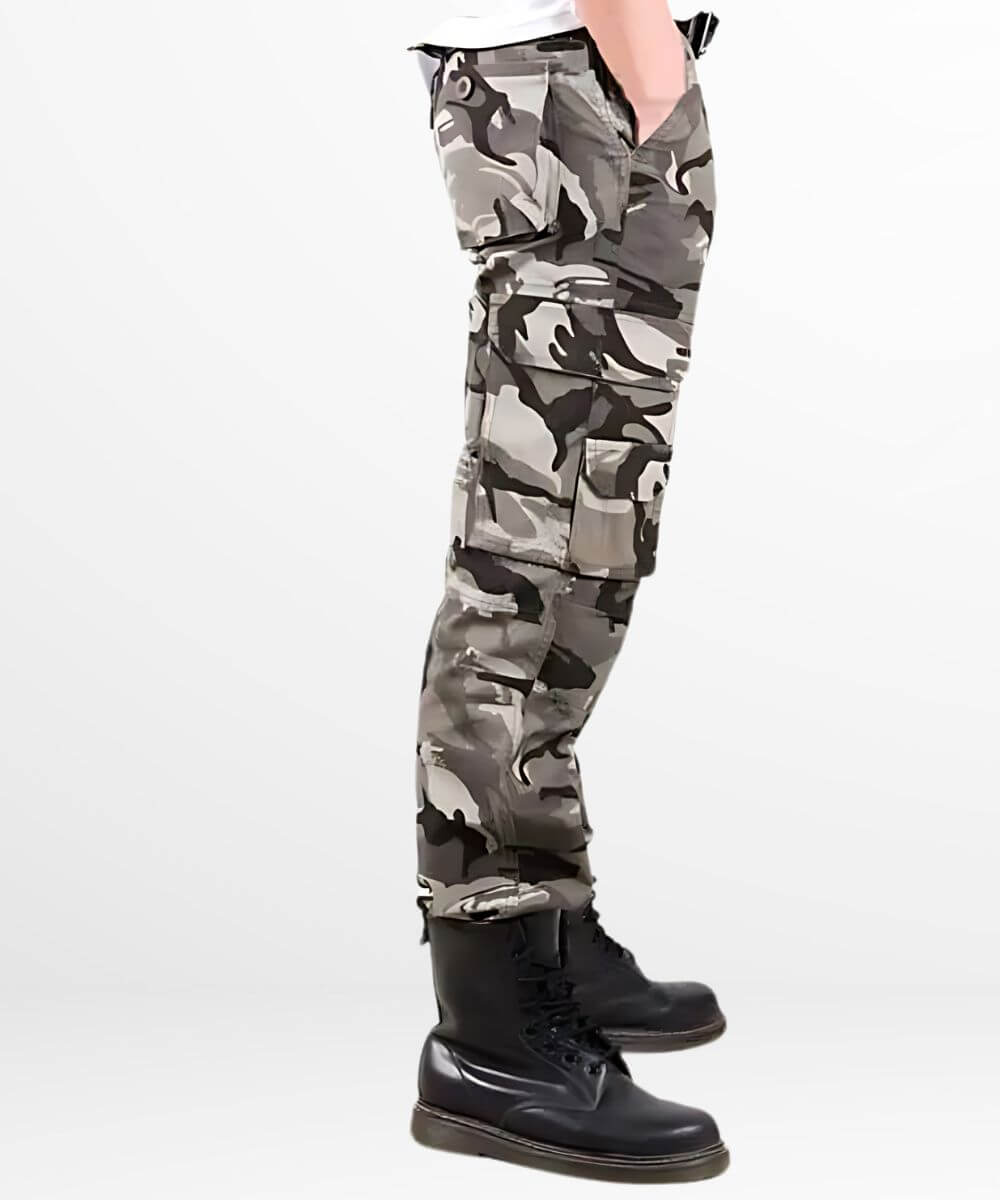 Side view of black, grey, and white camouflage cargo pants with side pockets and snug boot fit.