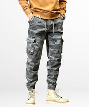 Trendy men's blue camo cargo pants with drawstring waist and side pockets.