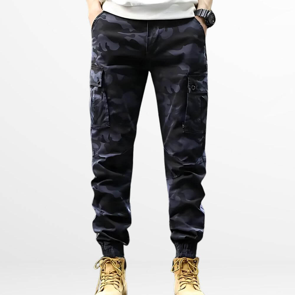 Front view of casual style men's blue camouflage pants paired with tan work boots.