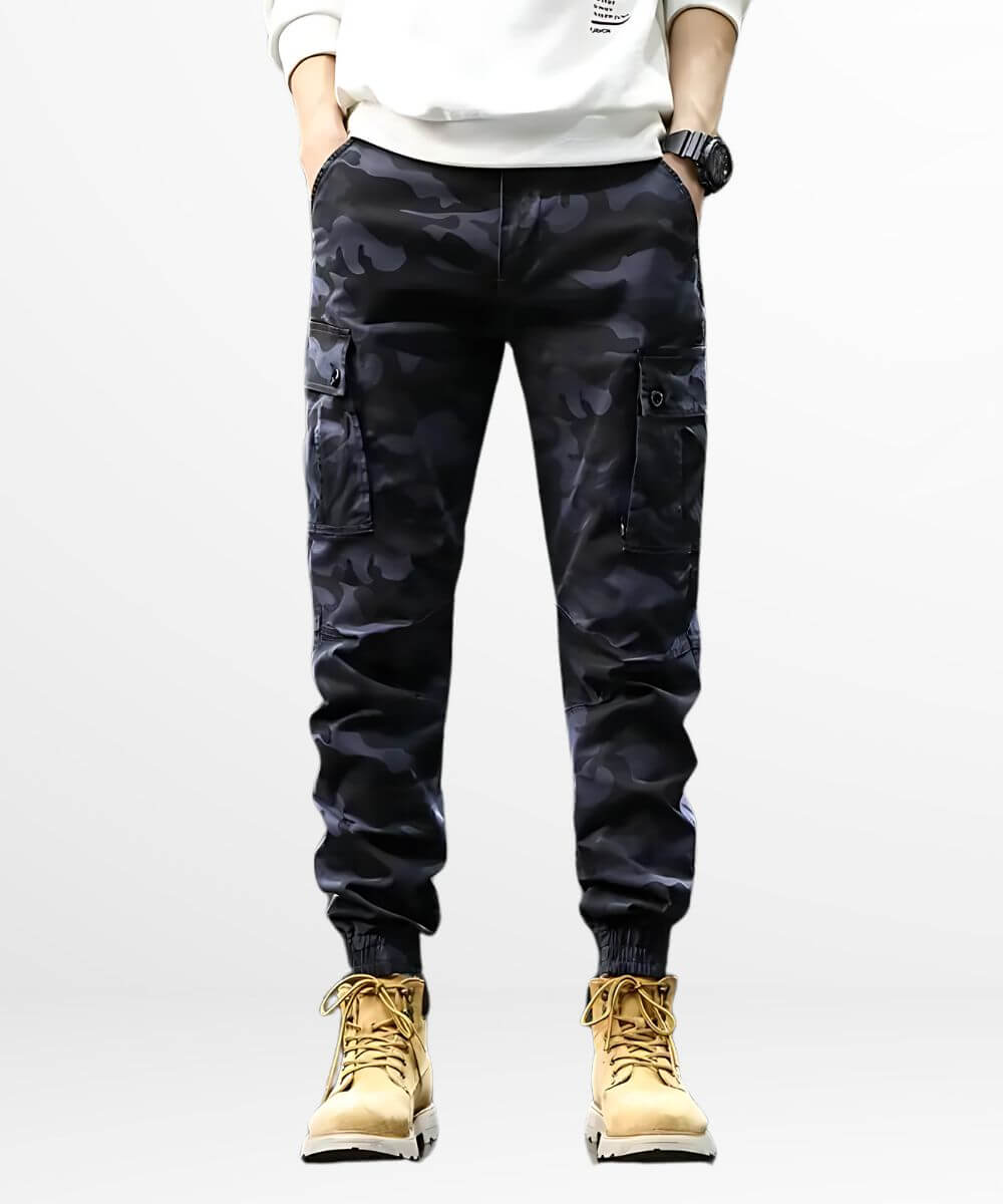 Front view of casual style men's blue camouflage pants paired with tan work boots.