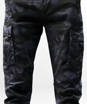 Close-up of men's blue camouflage pants highlighting the detailed cargo pockets and stitching.