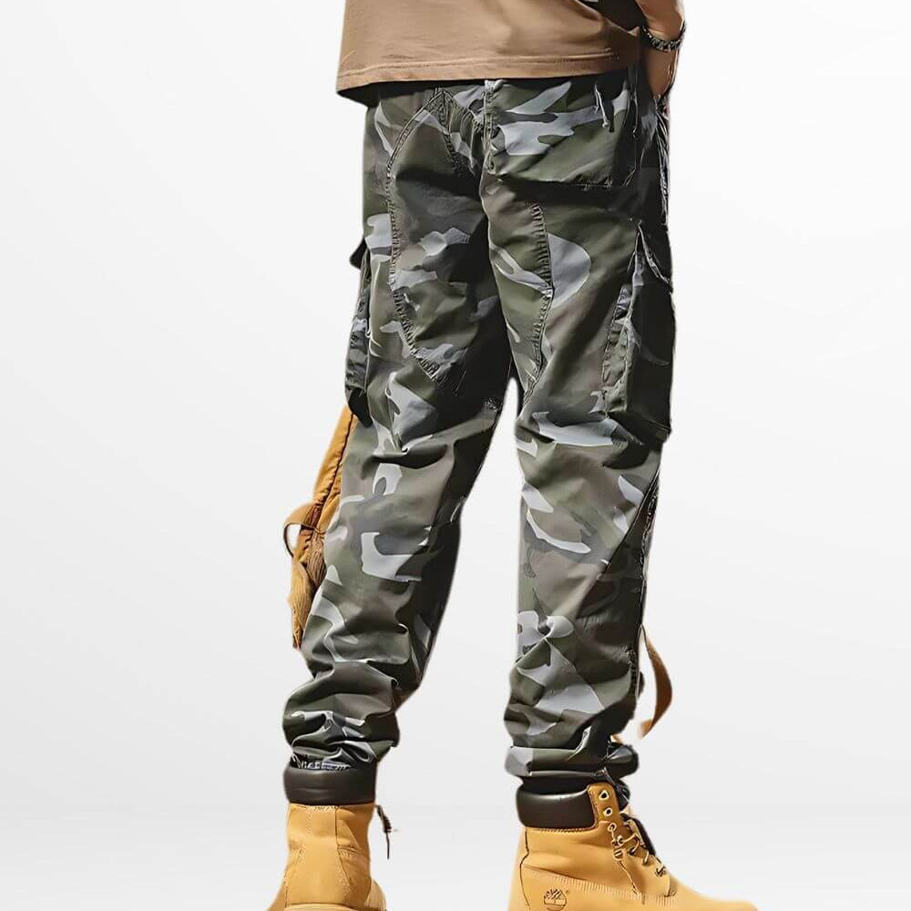 Side view showcasing the pocket details of men's blue camouflage pants.