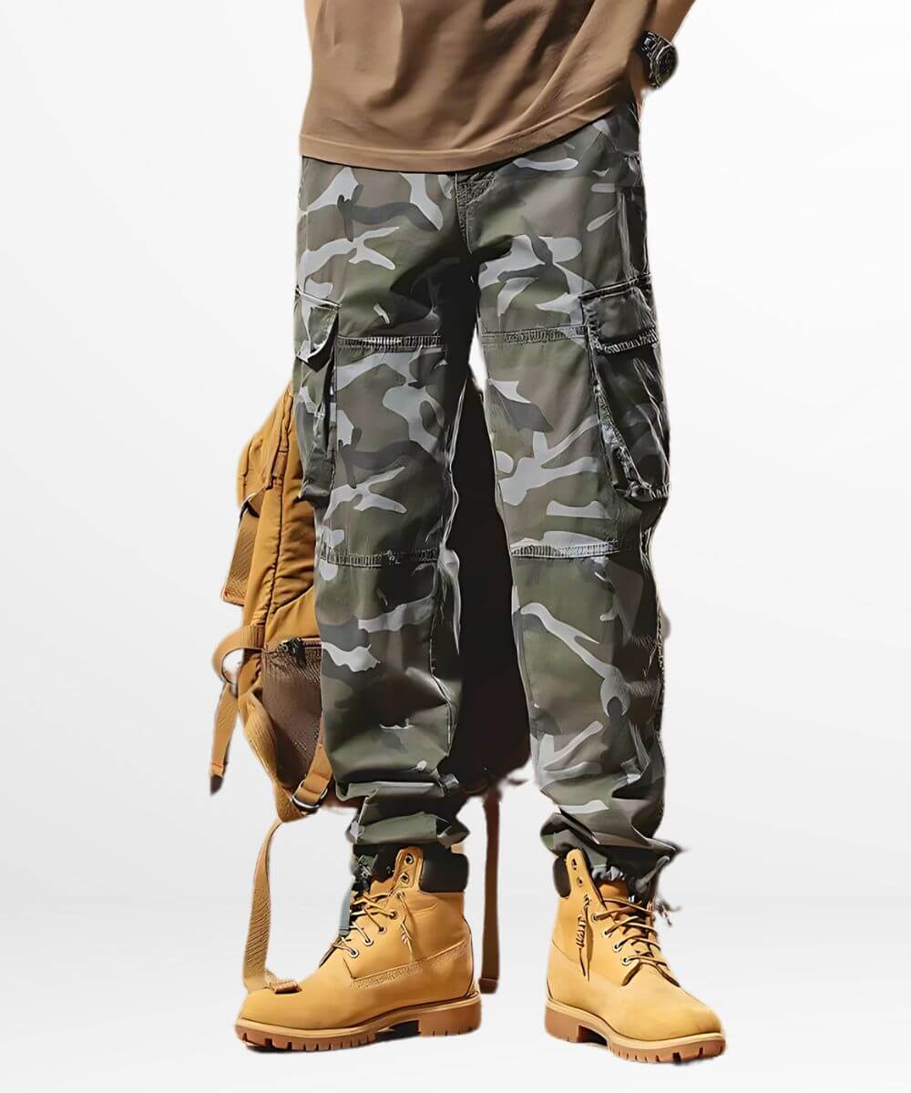 Front view of men's blue camouflage cargo pants with wristwatch and tan backpack.