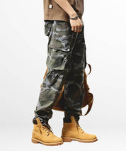 Full-length image of men's blue camouflage pants complemented by rugged tan boots.