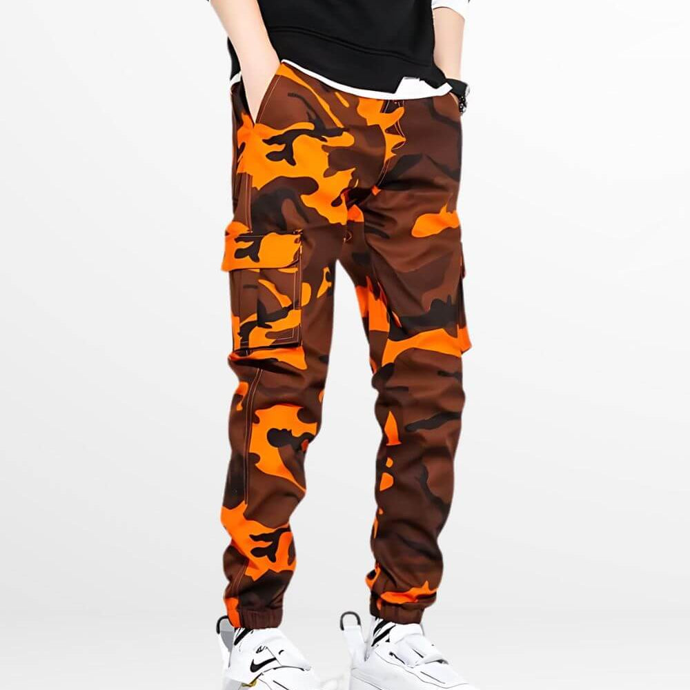 Bold camo and orange cargo pants paired with crisp white sneakers, creating a striking contrast for a standout casual look.