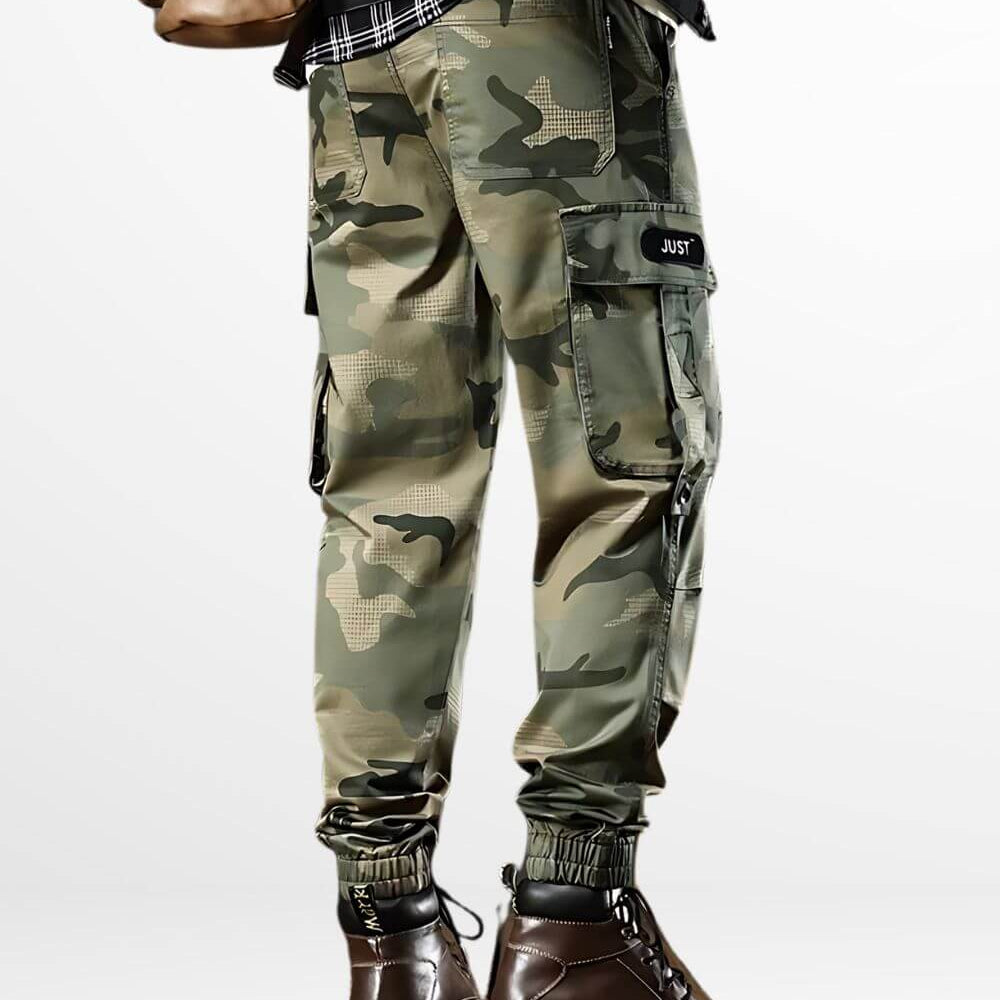 Back view of camo green cargo pants for men, highlighting the cargo pockets and paired with rugged brown boots.