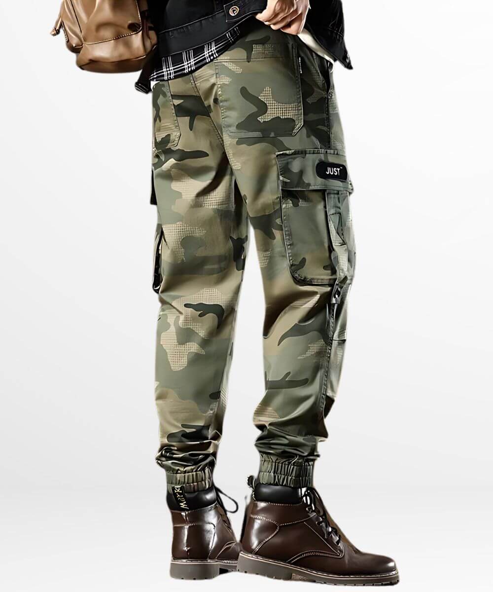 Back view of camo green cargo pants for men, highlighting the cargo pockets and paired with rugged brown boots.
