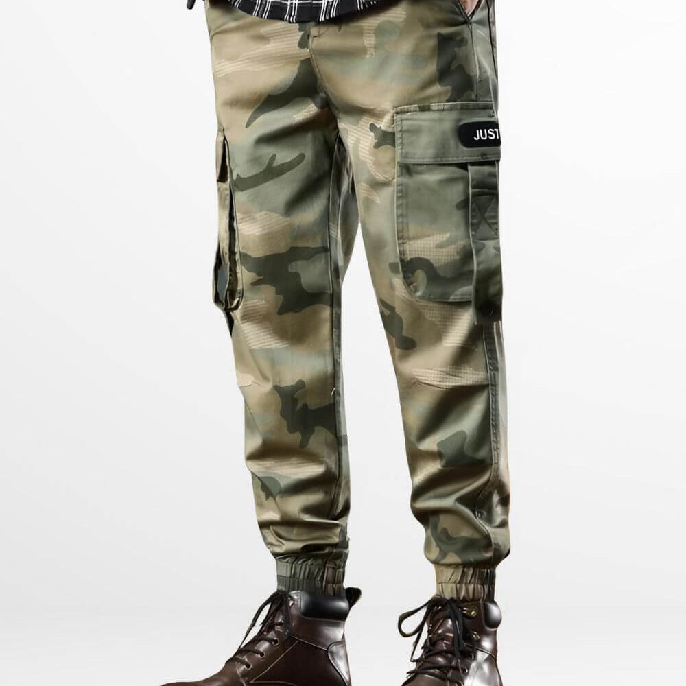 Front view of a man wearing camo green cargo pants paired with stylish lace-up brown boots.