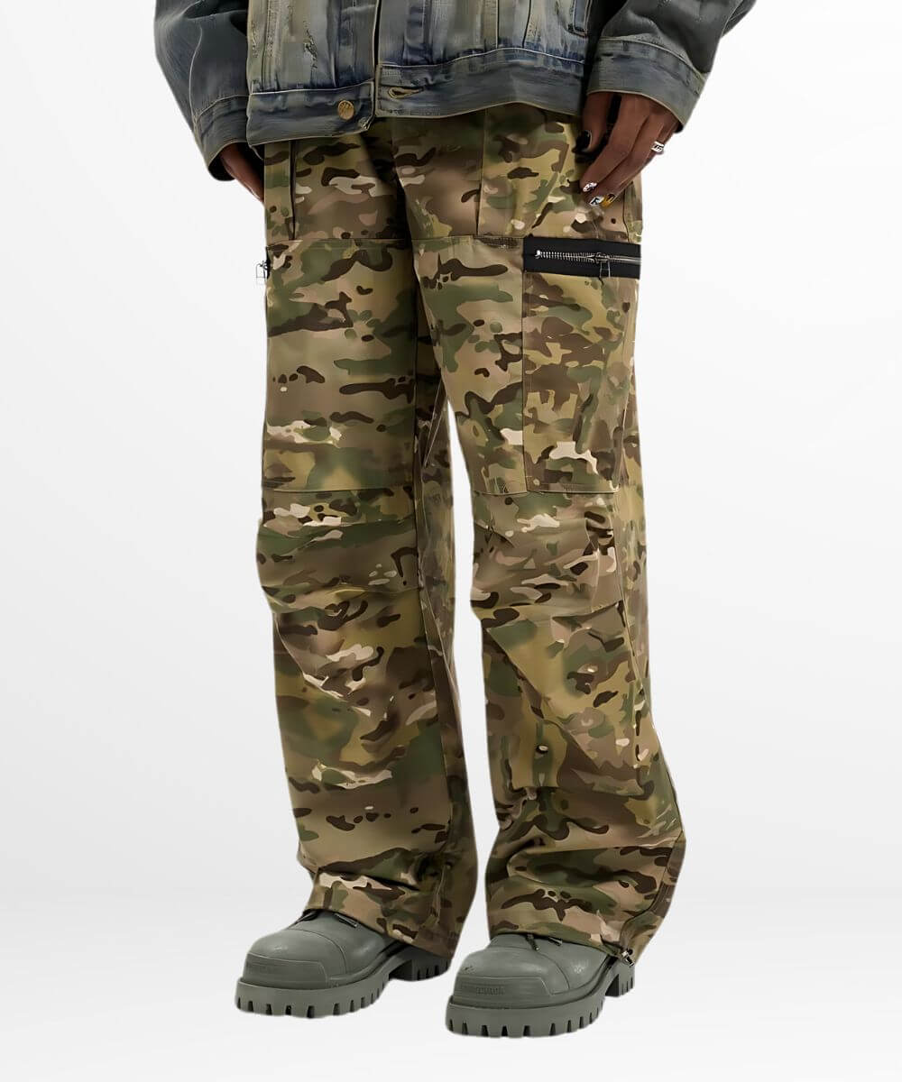 Full length front view of baggy camouflage pants paired with grey boots and a denim jacket.