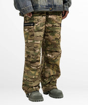 Front view focusing on the pocket details of baggy camouflage pants with denim jacket.