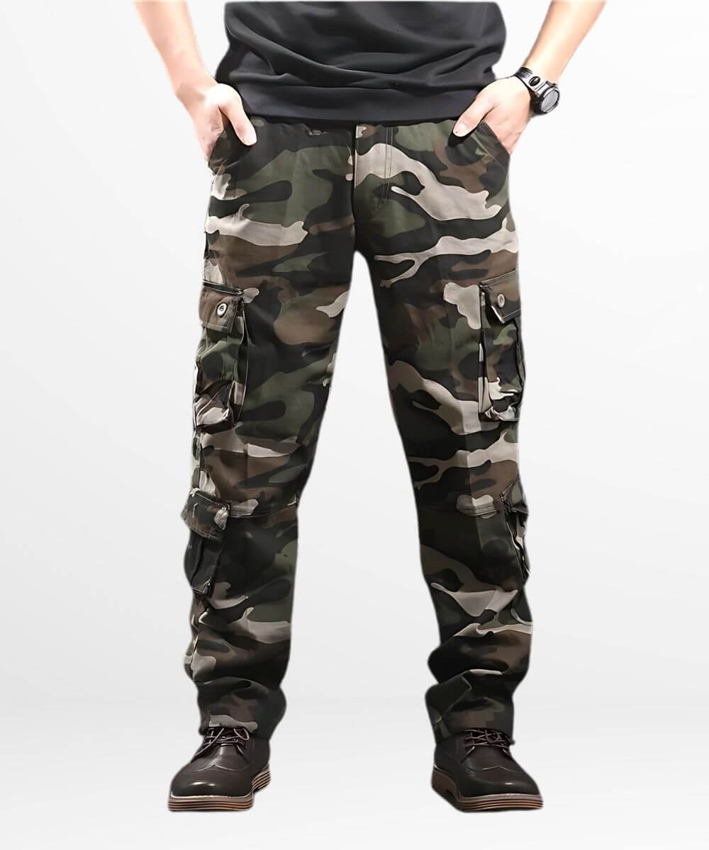 Man standing front view in men's cargo camo pants with sleek black boots.