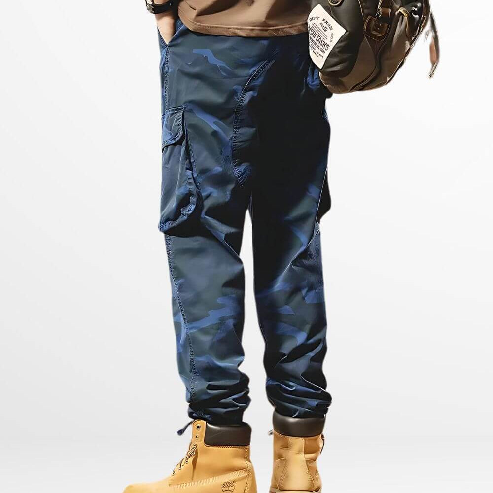 Side view of men's casual dark blue camo pants with a detailed cargo pocket design, styled with robust work boots.