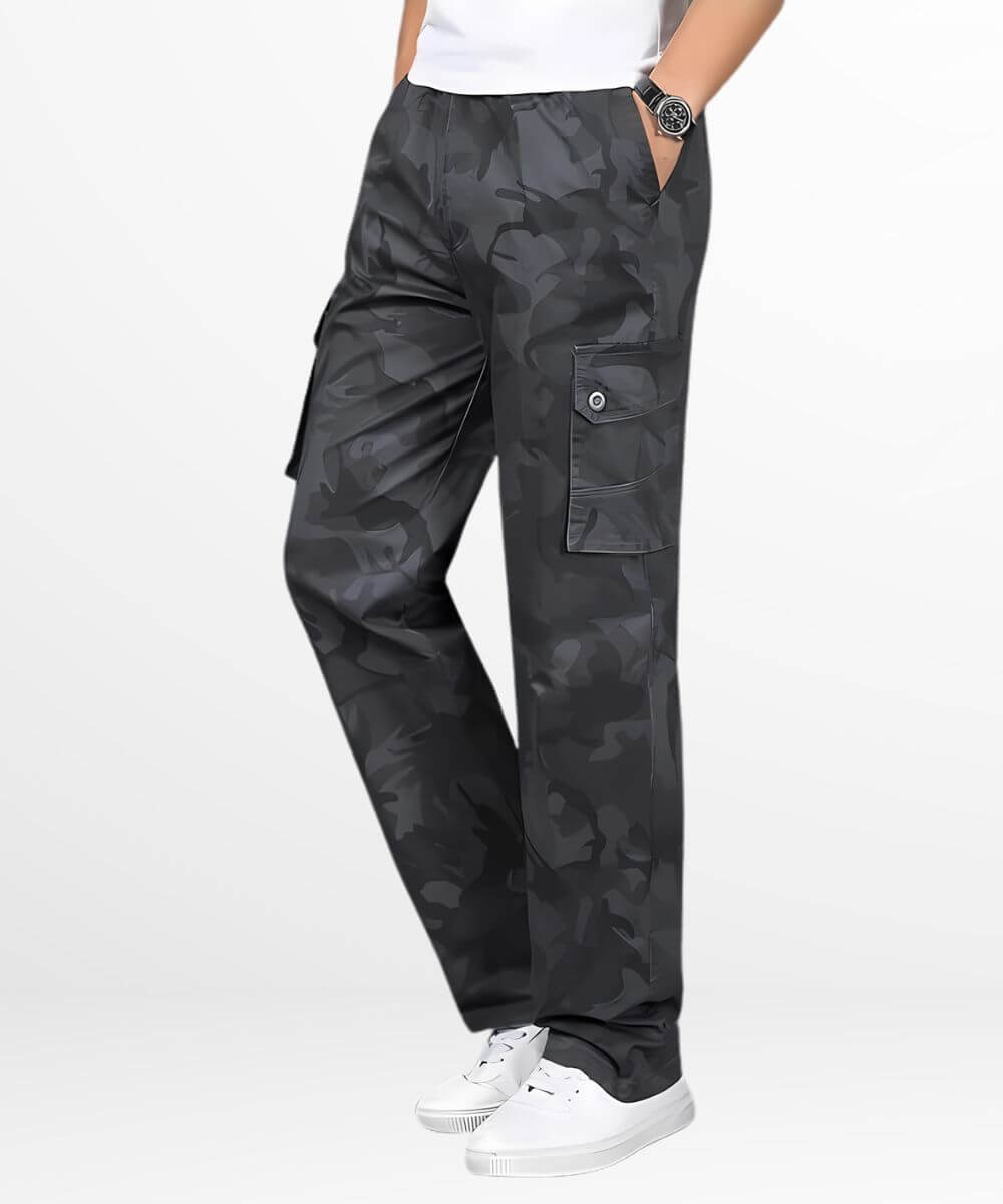 Side angle of casual dark grey camo cargo pants with utility pockets, complemented by white low-top sneakers.