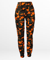 Front view of plus-size orange camo pants on a model.