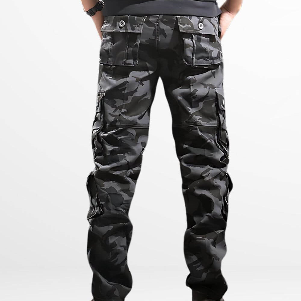 Back view of dark camo cargo pants showcasing the multiple utility pockets and comfortable fit, paired with stylish boots.