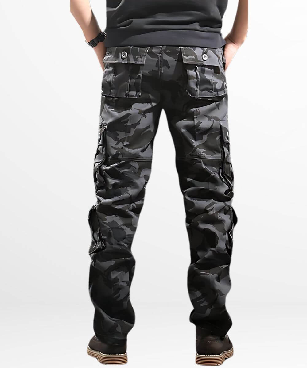 Back view of dark camo cargo pants showcasing the multiple utility pockets and comfortable fit, paired with stylish boots.