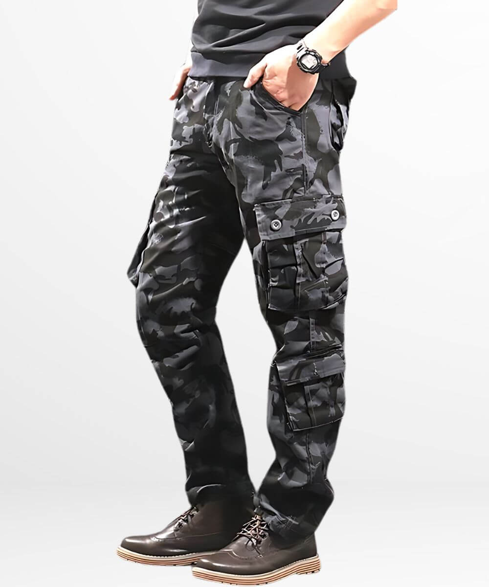 Side view of a person wearing dark camo cargo pants with hand casually placed in pocket, complemented by dark brown boots.