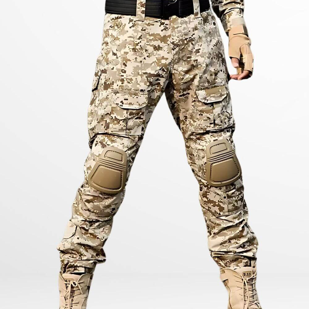 Front view of a man in ready stance wearing desert camo pants for men, complete with tactical belt and boots for desert terrain.