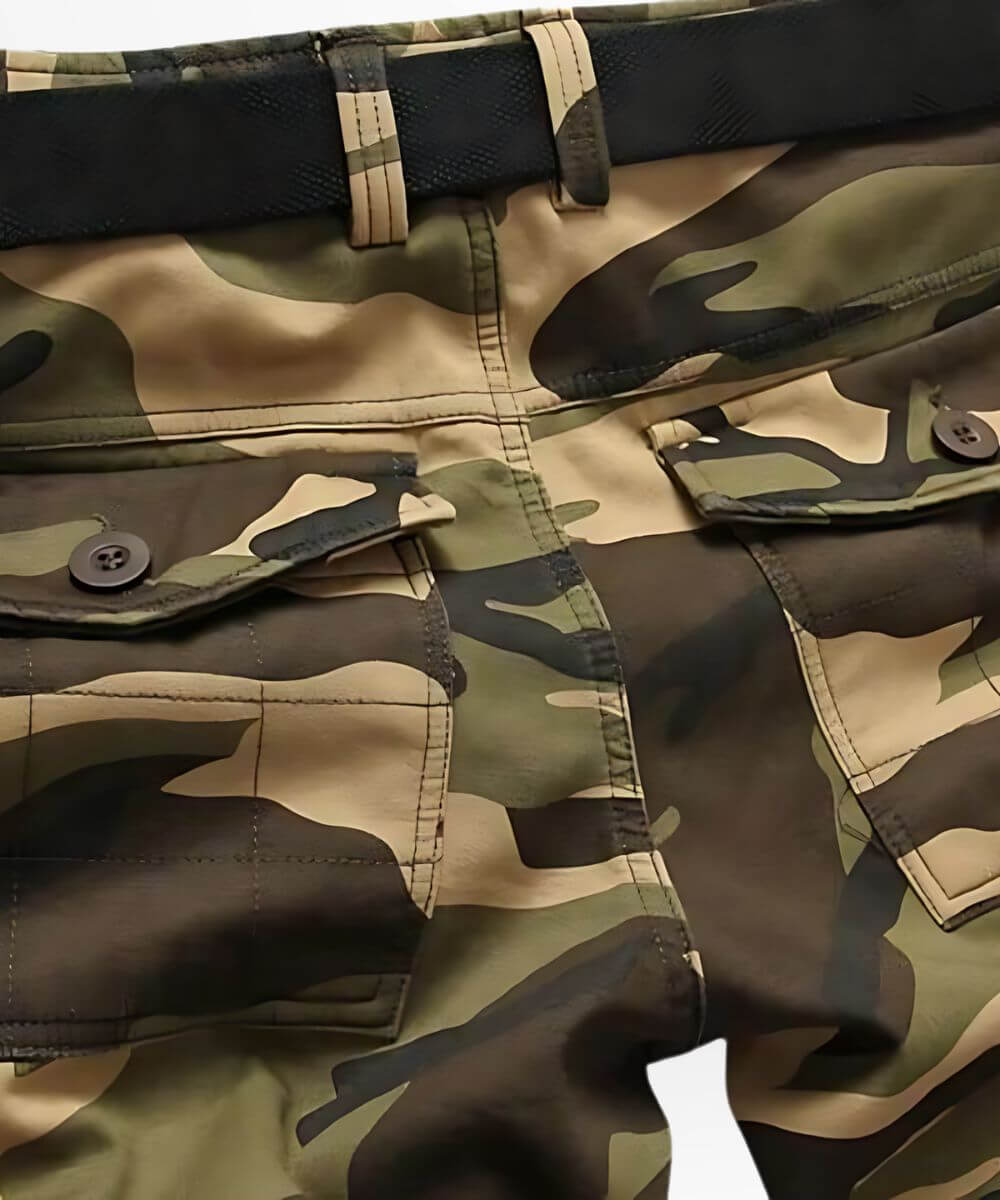 Close-up view showing the detailed waistband and button of the military camo cargo pants.