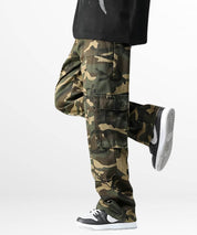 Action shot of a person in men's baggy camo cargo pants, mid-stride, emphasizing the comfortable fit and movement-friendly design.