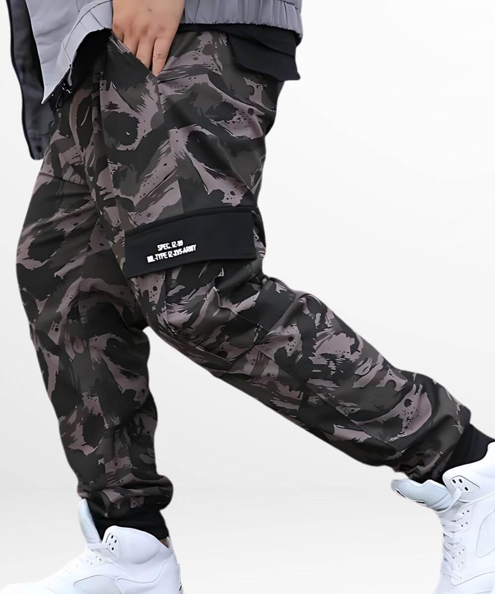 Close-up of fashion-forward men's camouflage baggy pants featuring cuffed ankles and a relaxed fit.