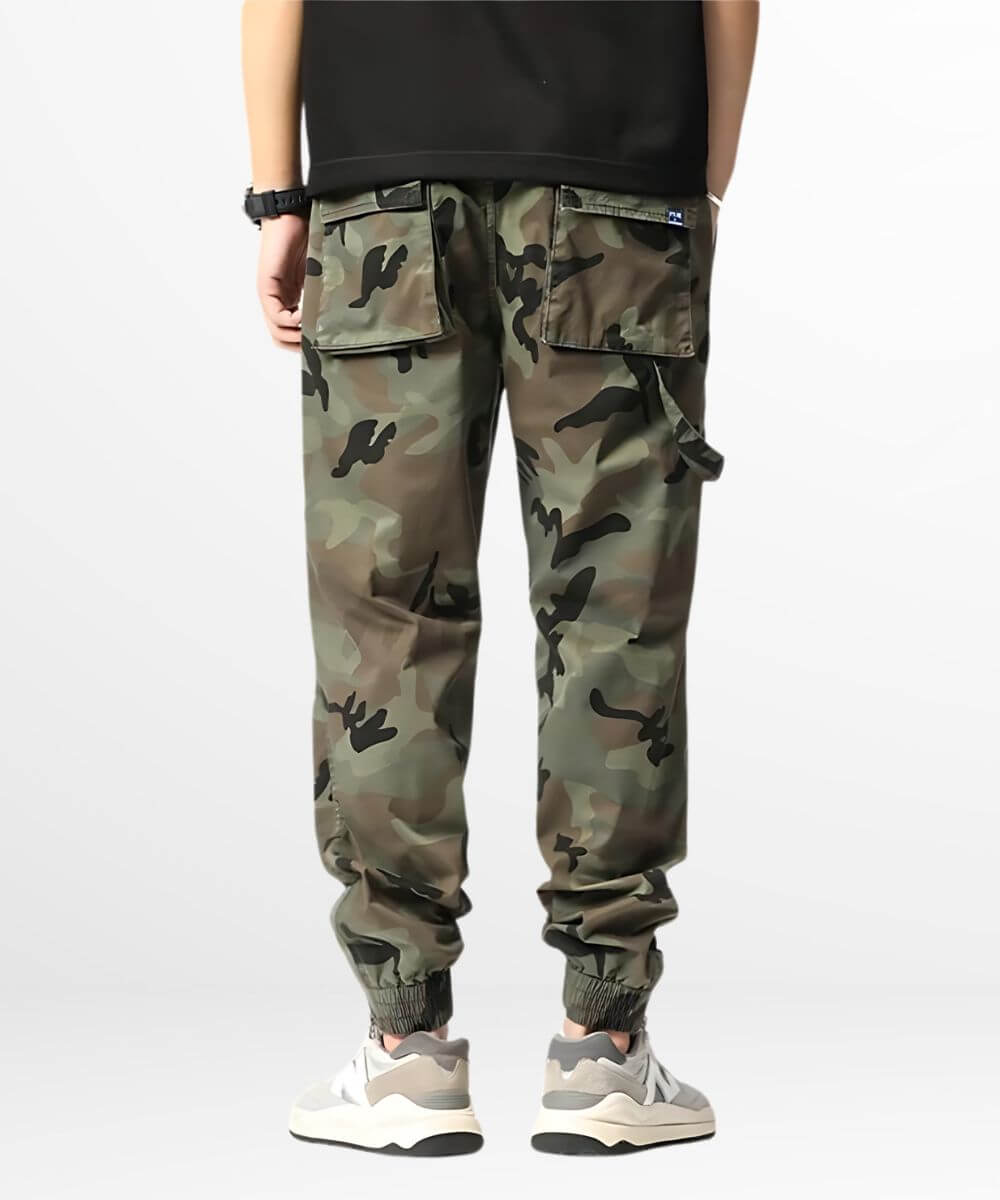 Back view of a person wearing green camo cargo sweatpants, showing off the detailed pocket styling and comfortable fit, perfect for a street-style look.