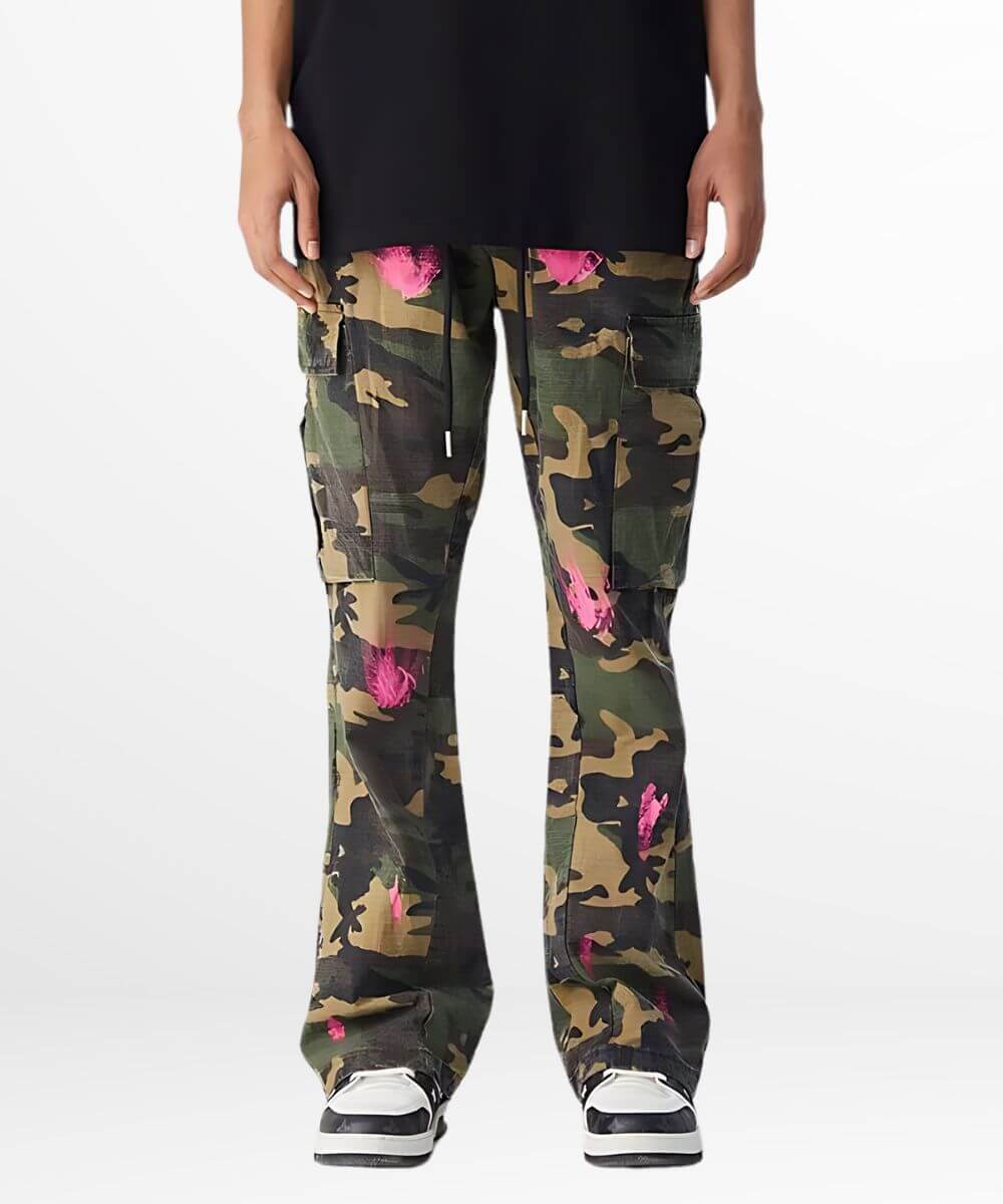 Front view of green and pink camouflage pants with drawstring and sneaker details.